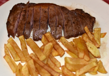 Presa de cerdo con patatas fritas